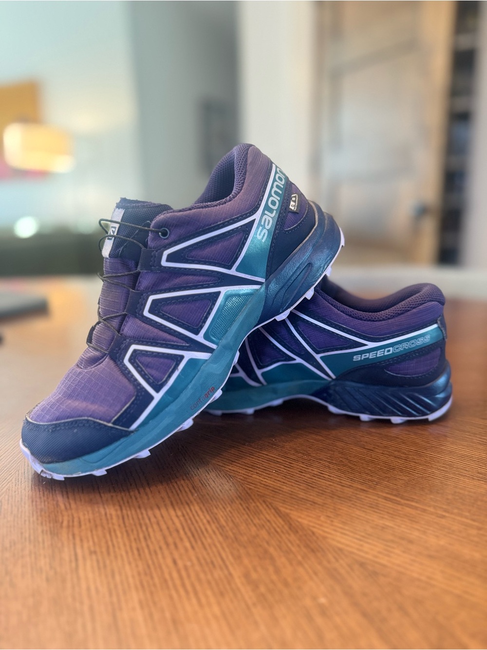 Salomon Kids Waterproof Trail Runners in Purple with Teal Accents